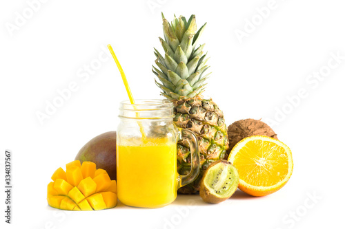 fresh citrus smoothie in a glass goblet, mango, pineapple, kiwi, coconut and orange isolated on white background