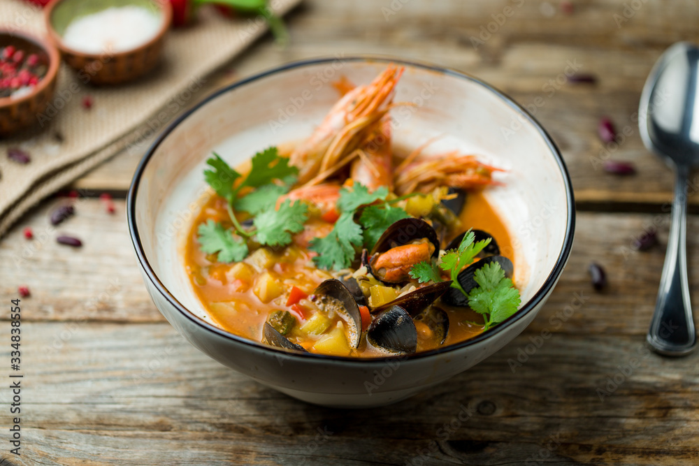 Seafood casserole bowl on wooden table