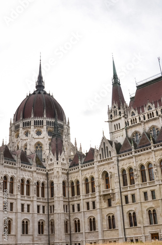 Building of the Hungarian Parliament Orszaghaz in Budapest, Hungary. The seat of the National Assembly. Detail photo of the facade. House built in neo-gothic style. Vertical photo