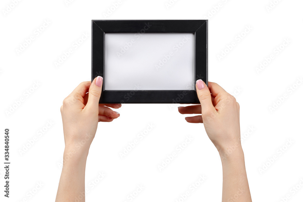Female hands holding photo frame with copy space isolated on white Female hands holding photo frame with copy space isolated on white