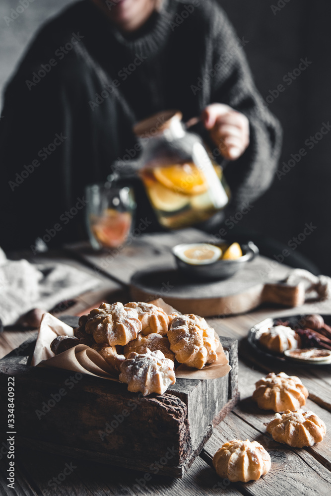 Woman is pours Hot tea with fresh grapefruit on wooden tablet. Healthy drink, Eco, vegan. Woman is pours Hot tea with fresh grapefruit on wooden tablet. Healthy drink, Eco, vegan.