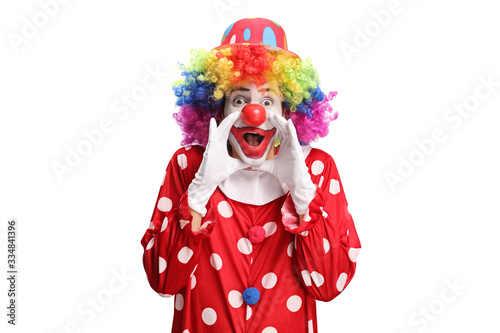 Clown in a polka dot red costume shouting