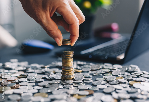 Business women put coin stack money. Concept of save money for future and business. Inspiration finacial  concept. photo