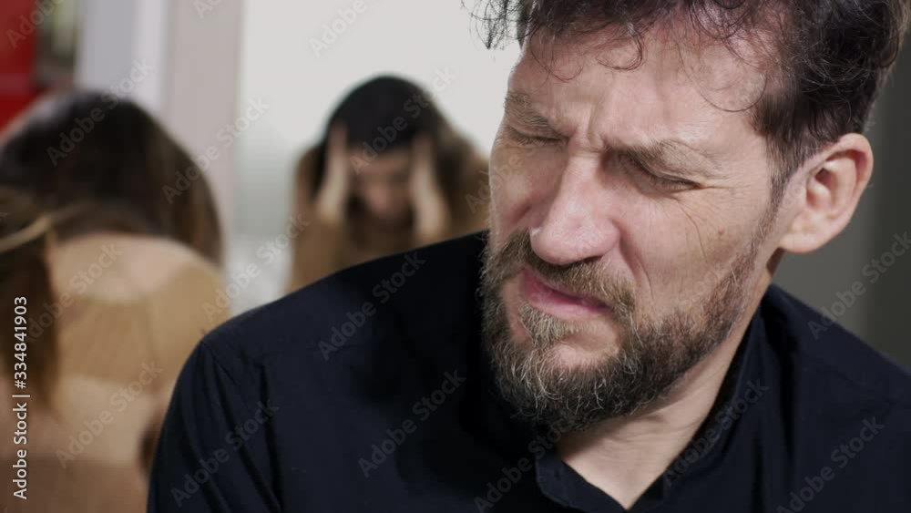 Sad angry unhappy man during conflict with girlfriend Sad angry unhappy man during conflict with girlfriend