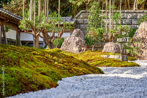 Japanese dry garden with stones and moss surface