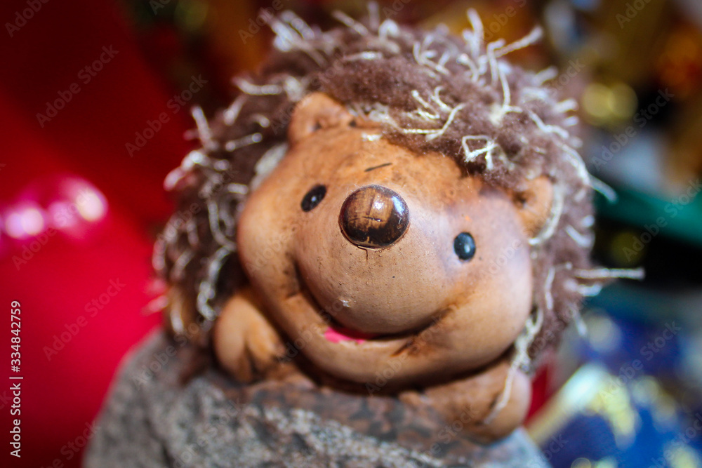 A small statuette of a hedgehog who laughs A small statuette of a hedgehog who laughs