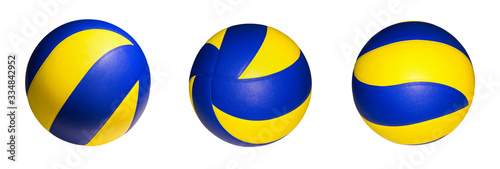 Schilderij op canvas Closeup three yellow blue volleyball sports equipment with light shining, isolat