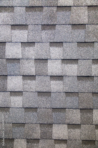Tile is a multi-layer flexible gray rectangular shape. Construction, background, textures, design.