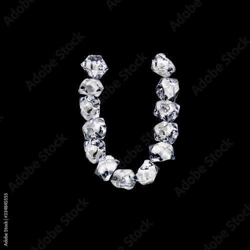 Single letter "U" made of ice or cracked glass isolated on black background