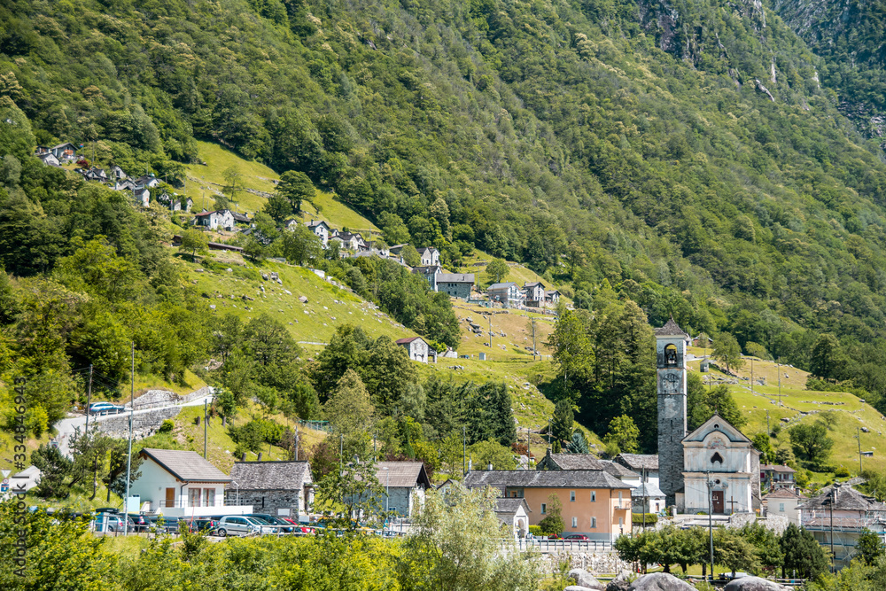 Landscape panorama of romantic famous tourist destination - An old Swiss village with double arch stone bridge, Lavertezzo, Verzascatal, Canton Tessin.