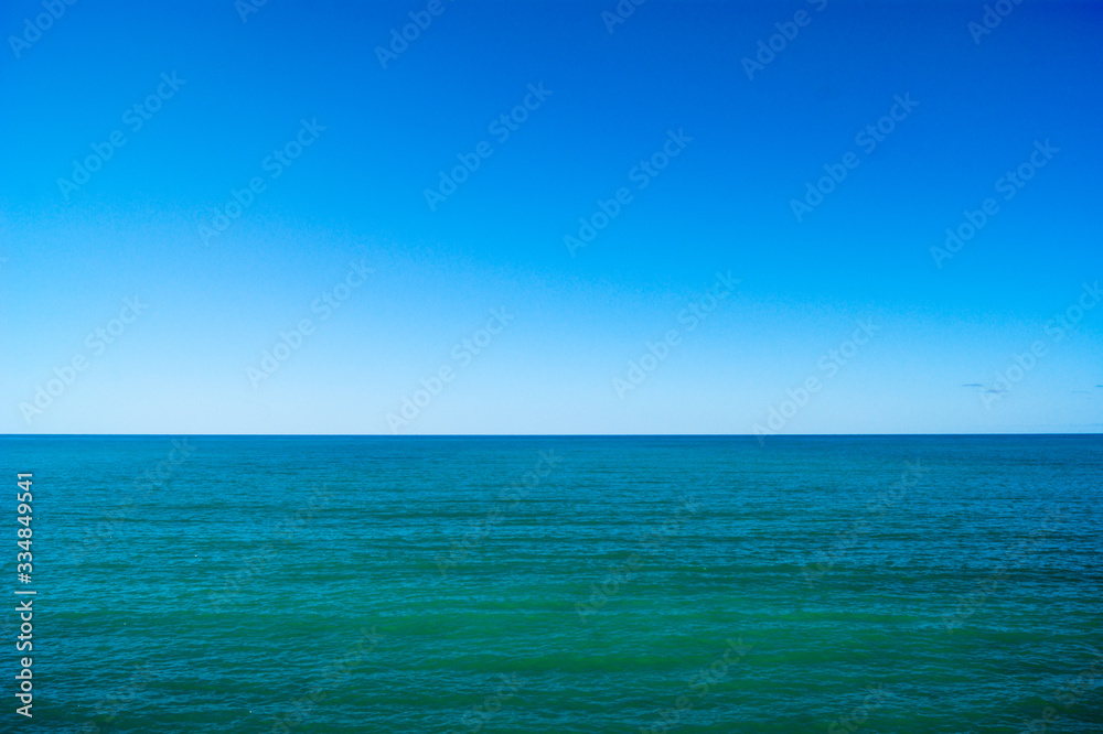 Calm sea and blue sky, horizontal photo. Calm sea and blue sky, horizontal photo.