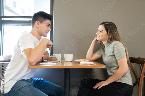 Cute couple dating in a coffee shop