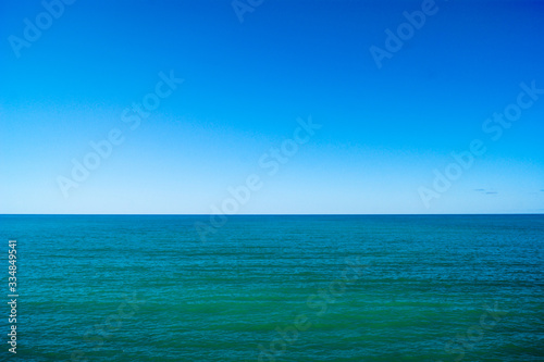 Calm sea and blue sky, horizontal photo.