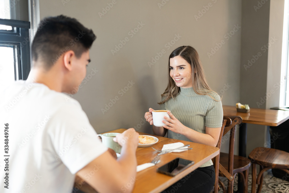 Happy couple enjoying coffee together