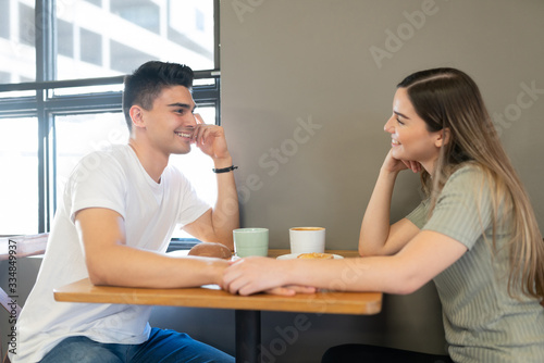 Cute couple dating in a restaurant
