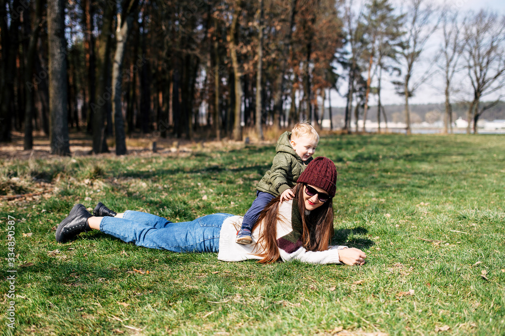 Mother and baby son spend time outdoors together Mother and baby son spend time outdoors together