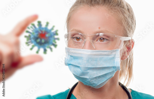 Doctor in protective mask is holding Coronavirus 2019-nCov. Outbreaking COVID-19 virus.