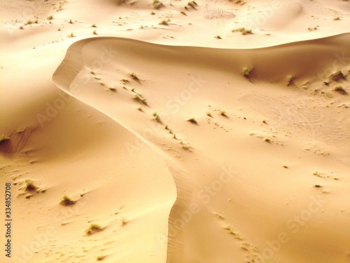 Sand dune. a beautiful landscape under the sun shining high in the sky.
