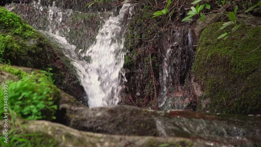 Mountain stream of clean and clear water flows in the mountains. Ecology and water supply of the earth. Slow motion Mountain stream of clean and clear water flows in the mountains. Ecology and water supply of the earth. Slow motion