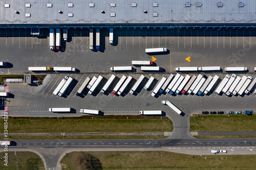 Obraz na płótnie Aerial drone on trucks and logistic center. Warehouse aerial w salonie