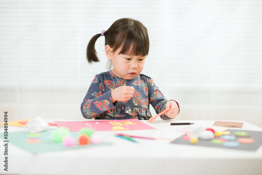 toddler girl making craft for homeschooling toddler girl making craft for homeschooling
