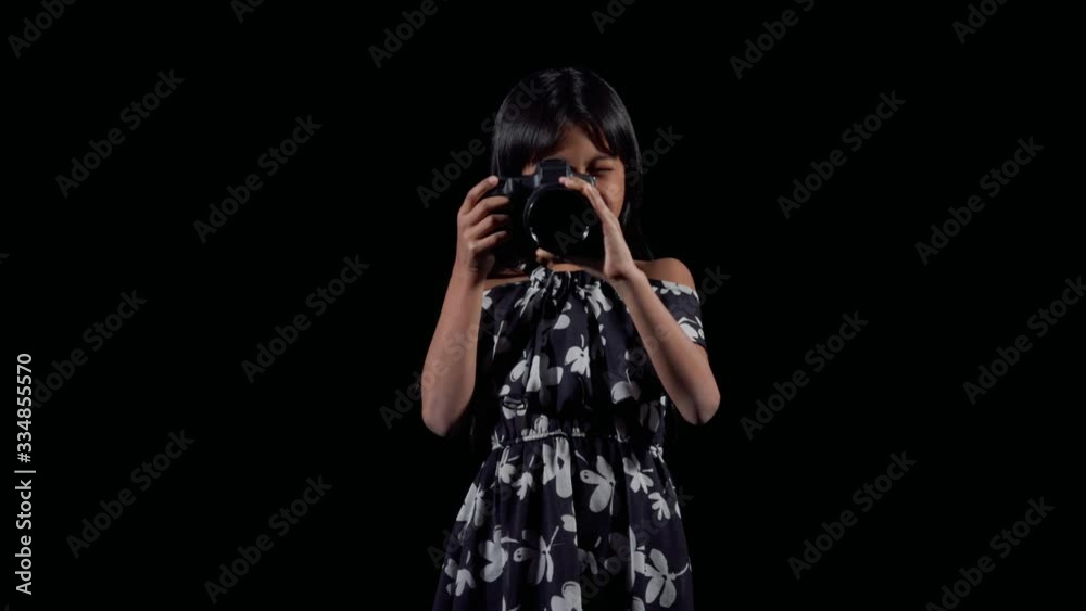 A little asian girl shoots a photography A little asian girl shoots a photography