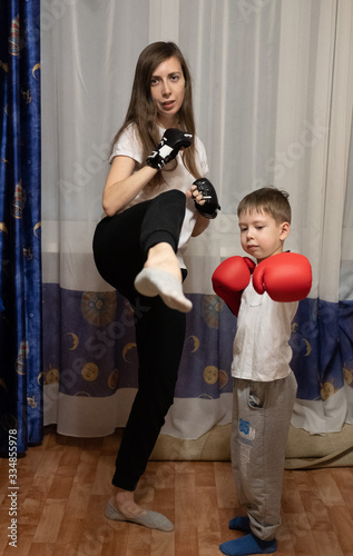 mom and son play sports at home