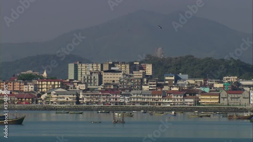 Wide Panorama view of the Old Town of Panama City, Plaza de Francia, the presidency of the republic, and walled fort, with the modern metropolis Panama City in the background