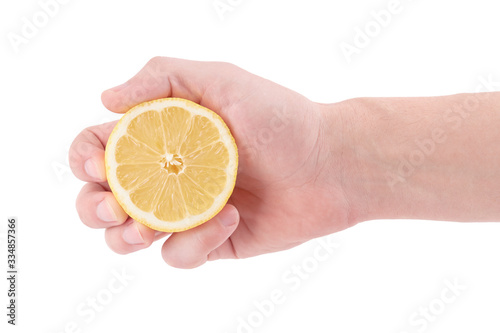 Fresh chopped lemon in caucasian person hand isolated on a white background. Pressure concept.