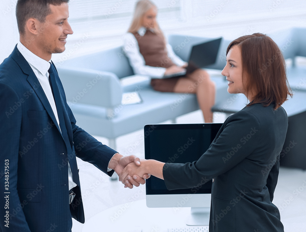 handshake business partners at the negotiating table. handshake business partners at the negotiating table.