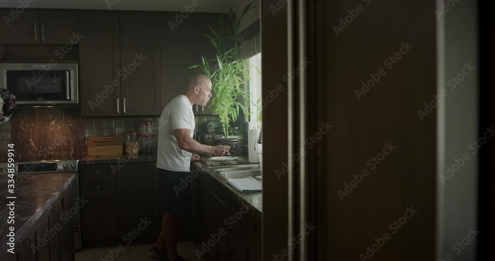 Man cooking breakfast in kitchen Man cooking breakfast in kitchen