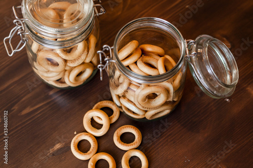 Snacks bakkery cookies bagels chocolate candies for tea coffee milk juice on a wooden table background. photo