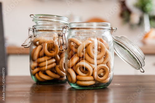 Snacks bakkery cookies bagels chocolate candies for tea coffee milk juice on a wooden table background. photo