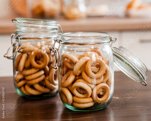 Snacks bakkery cookies bagels chocolate candies for tea coffee milk juice on a wooden table background. photo