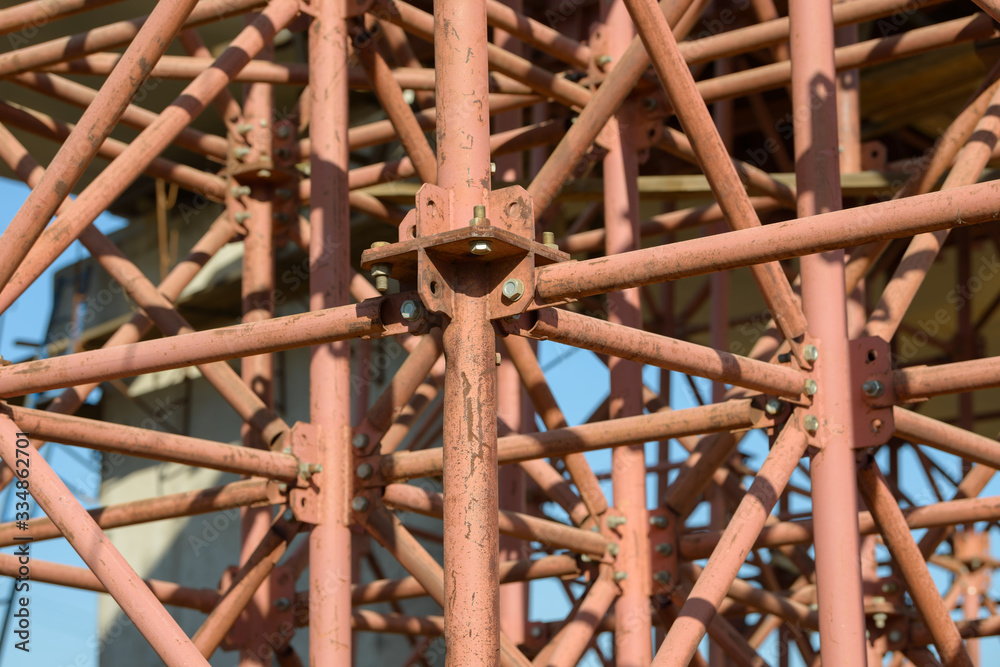 Scaffolding Elements Construction. Metal scaffolding tubes and bars. Construction site details. Bridge support. Industrial background.