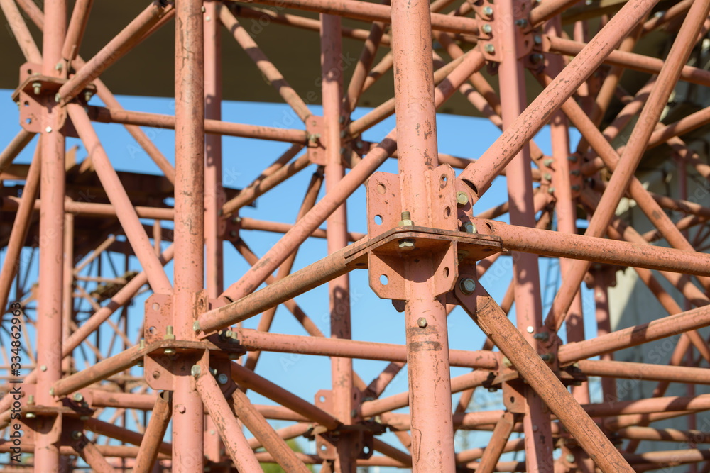 Scaffolding Elements Construction. Metal scaffolding tubes and bars. Construction site details. Bridge support. Industrial background. Scaffolding Elements Construction. Metal scaffolding tubes and bars. Construction site details. Bridge support. Industrial background.