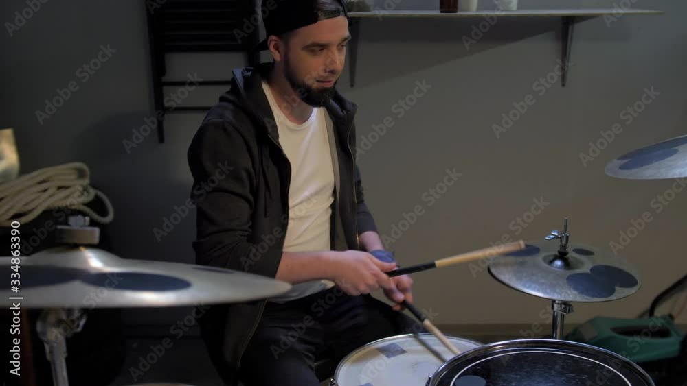 Drummer at rehearsal in the garage Drummer at rehearsal in the garage