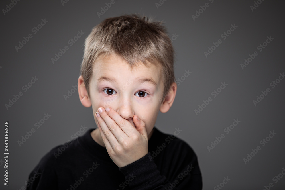 Grief-stricken little boy - feeling intense sorrow, remorse, sadnesss - studio portrait - vivid emotions series Grief-stricken little boy - feeling intense sorrow, remorse, sadnesss - studio portrait - vivid emotions series