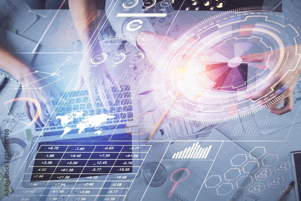 Double exposure of man and woman working together and data theme hologram drawing. Computer background. Top View. Double exposure of man and woman working together and data theme hologram drawing. Computer background. Top View.