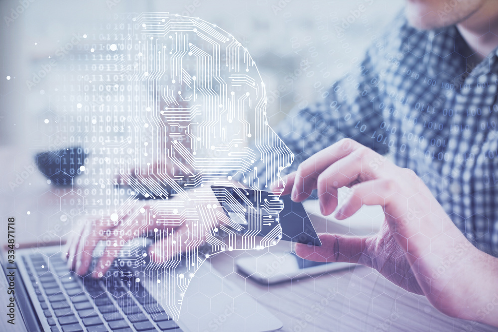 Double exposure of man hands typing on computer with credit card and brain theme drawing. E-commerce and AI concept. Double exposure of man hands typing on computer with credit card and brain theme drawing. E-commerce and AI concept.