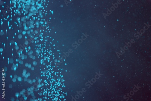 light blue a lot of flying festival glitters bokeh texture - nice abstract photo background