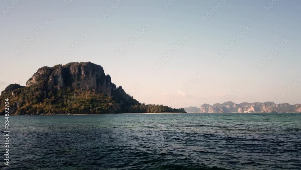 Rough cliff mountain above blue sea Rough cliff mountain above blue sea