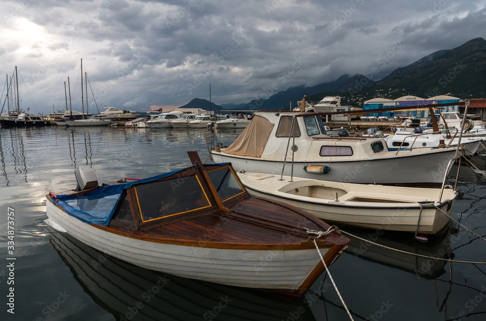 boats in harbor, stormy weather