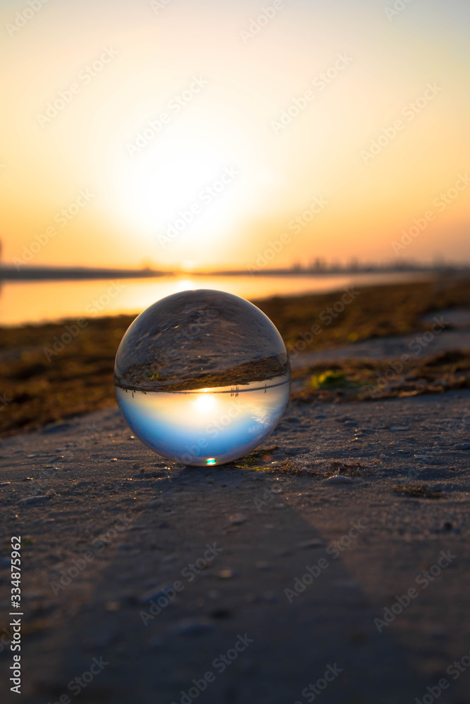 crystal ball on a beach at sunset crystal ball on a beach at sunset