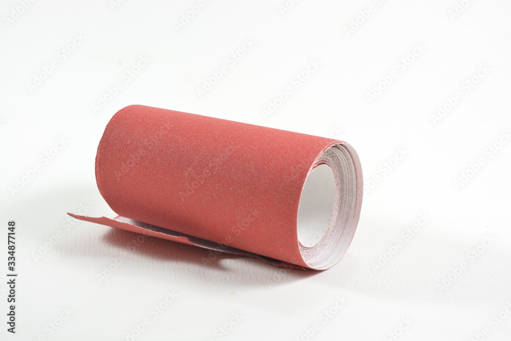 roll of red sand paper isolated on white roll of red sand paper isolated on white