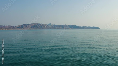 Wallpaper Mural Tracking shot from the sea over colorful rainbow mountains of Hormuz island Iran Torontodigital.ca