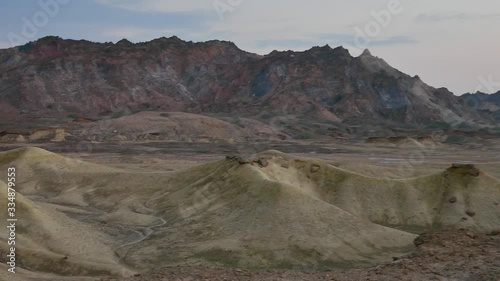 Right to left pan over stunning scenery colorful rainbow mountains with blue sky photo