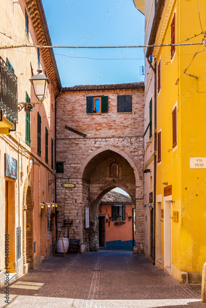 Sirolo street view with the medieval Gothic Arch, city gate of Sirolo, Province of Ancona, Marche, Italy