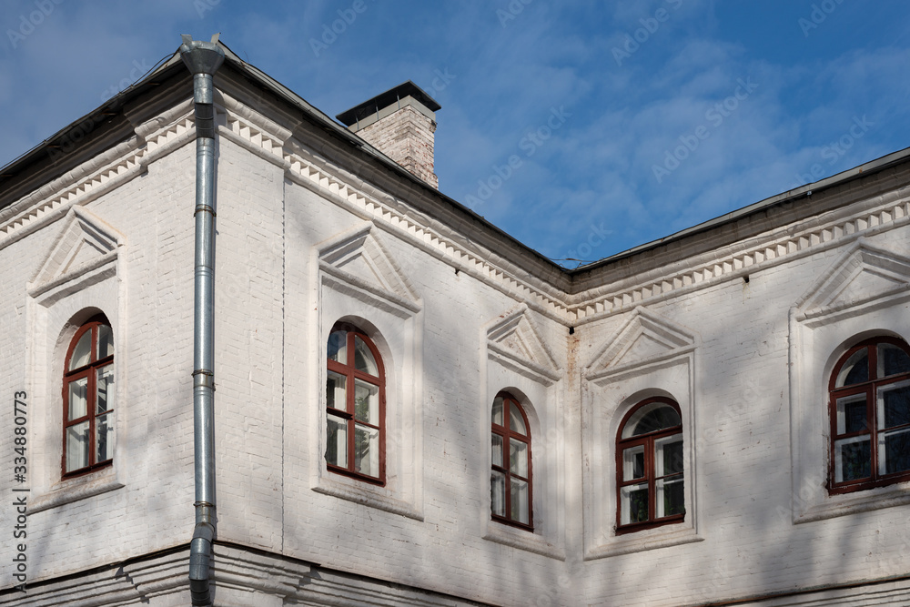 Fragment of the facade of an old building of the 18th century in the traditional russian style