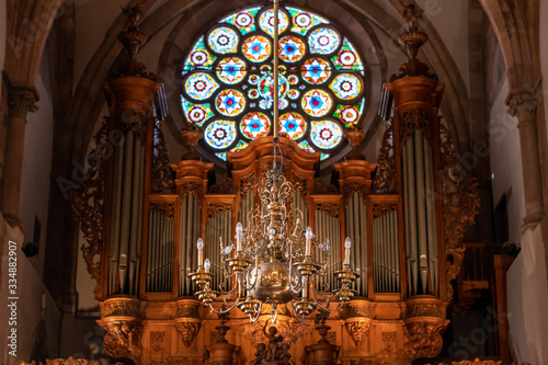 Organ and chandelier inside a cathedral in strasbourg france